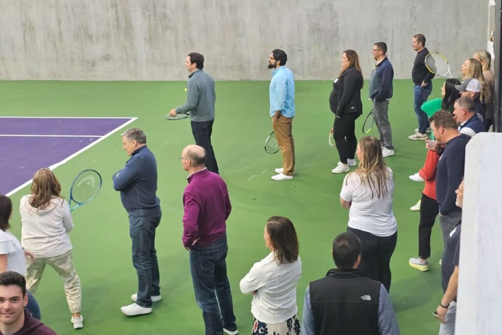 Associates waiting to play tennis